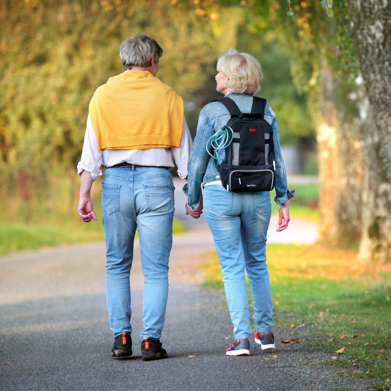 Zen-O Lite Portable Oxygen Concentrator with backpack - Patient walking outdoors